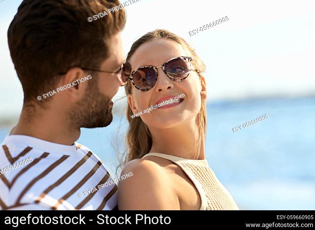 portrait of happy couple on summer beach