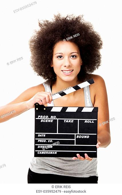 Beautiful african american woman laughing and holding a clapboard, isolated on white