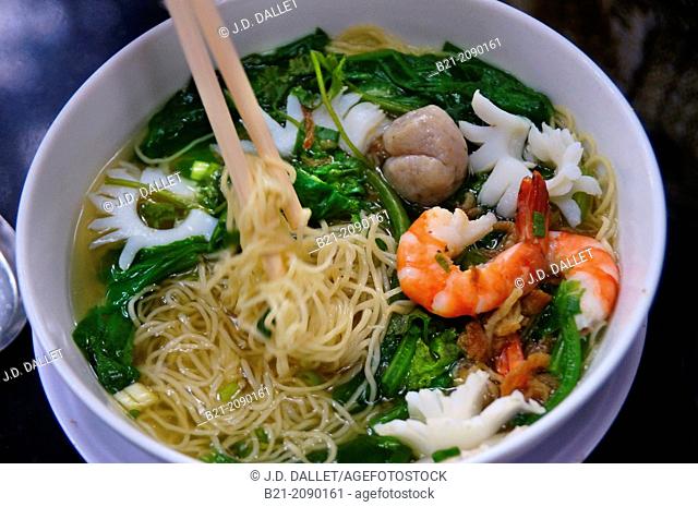 Vietnam. Hanoi. Food: noodles soup with vegetables, shrimps and squids