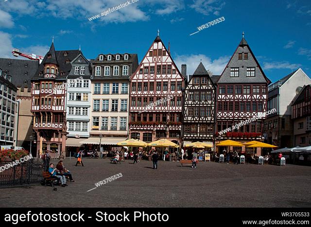 Frankfurt, Germany September 3 2015: Famous historical landmark of Romerberg square with tourist people walking at the city of Frankfurt in Germany