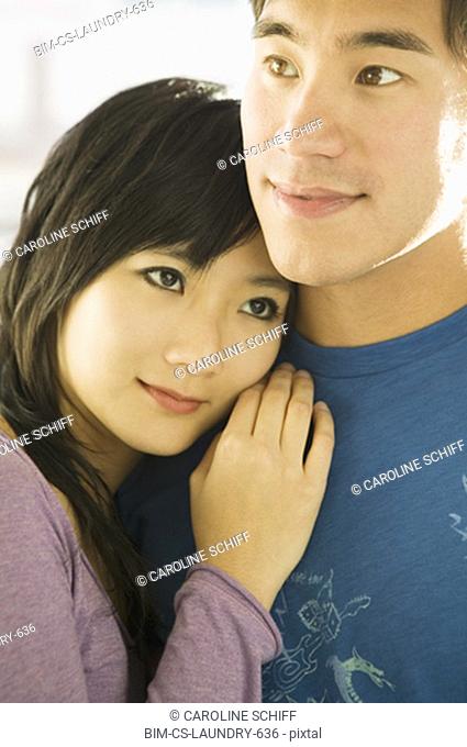 Asian couple hugging