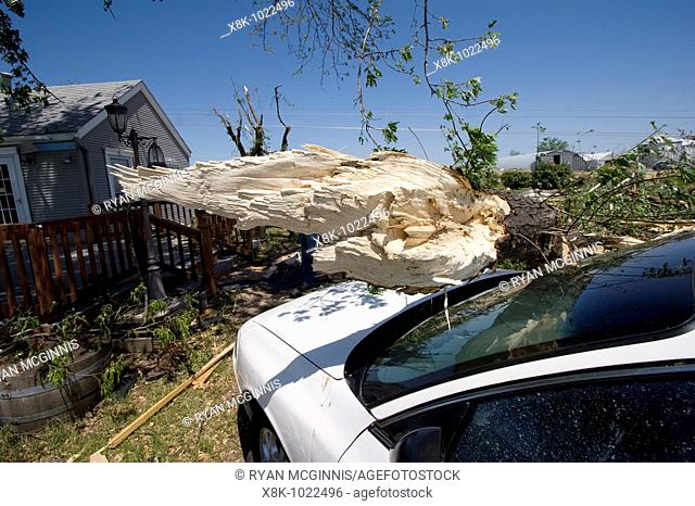 A tree fallen on a car at Bill Foster's home at 2165 East 39th Street in Kearney, Nebraska, May 30, 2008  Kearney was struck by an EF-2 tornado on May 29  2008
