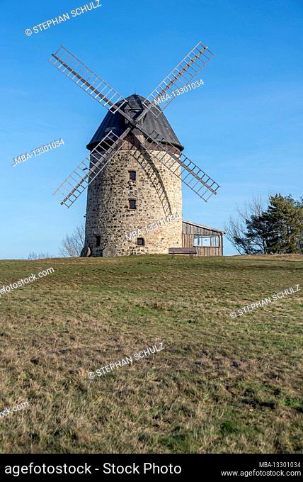 Germany, Saxony-Anhalt, Warnstedt, view of the Warnstedter Teufelmühle, a Dutch tower windmill that stands on the Eckberg