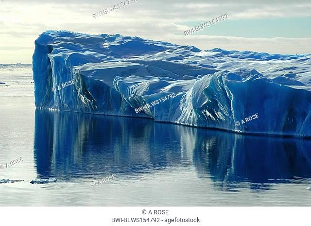 Blue iceberg with water reflection, Antarctica, Southern Ocean