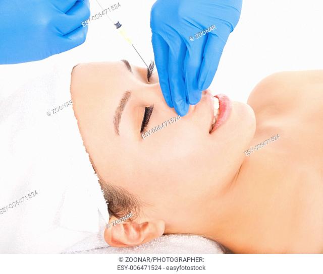 Woman is doing cosmetic surgery injections