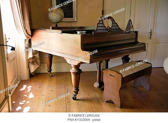 View of piano in living room