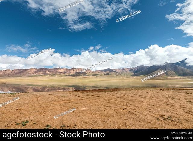 beautiful plateau landscape, wilderness lake and sky reflection with river beach