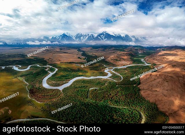 Kurai steppe and Chuya river on North-Chui ridge background. Altai mountains, Russia. Aerial drone panoramic picture