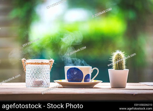 Enjoying a cup of tea in the own garden, copy space