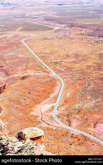 Winding roadway cutting through Valley of the Gods, Utah, USA