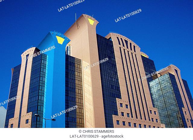 Banco Nacional Ultramarino. High rise building. Blue glass, brickwork