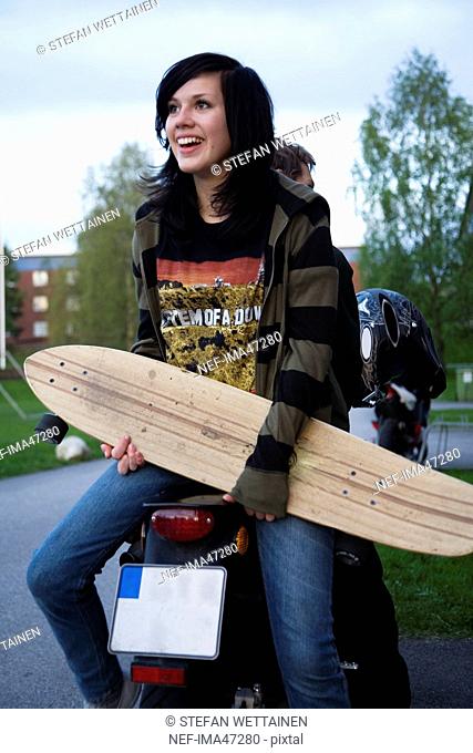 A teenage girl with a skateboard, Sweden