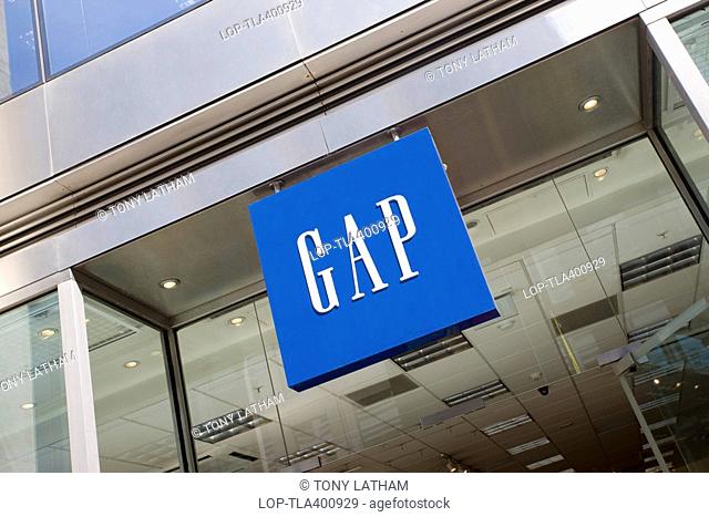 England, London, City of London, A GAP sign hanging outside one of their stores in the City of London