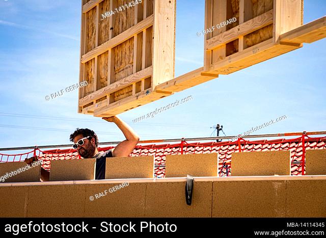 germany, bavaria, construction of a prefabricated wooden house, installation of a partition wall