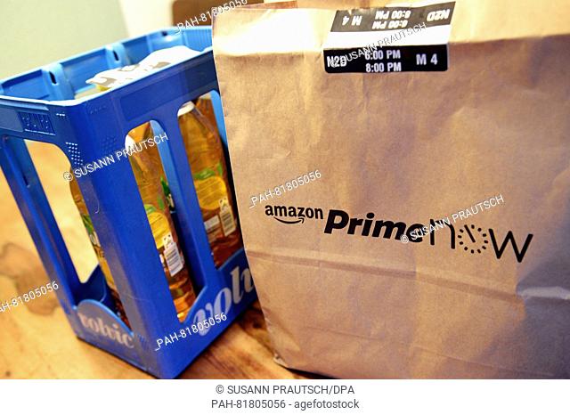 'Amazon Prime Now' is written on a paper bag in Berlin, Germany, 10 June 2016. Using the new delivery service of Amazon, orders such as electronic appliances