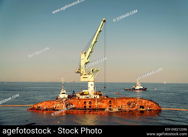 Rescue wrecked oil tanker Delfi in Odessa, Ukraine 26 August 2020, near Black Sea coast. Marine Crane lift wreck Delphi into sea