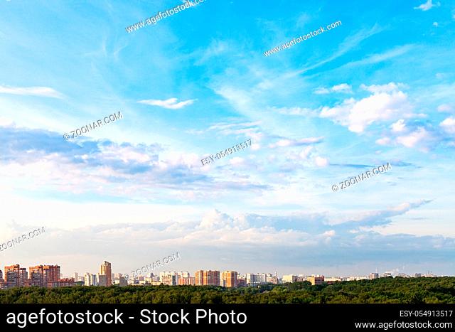 summer evening sky over modern residential district of Moscow city