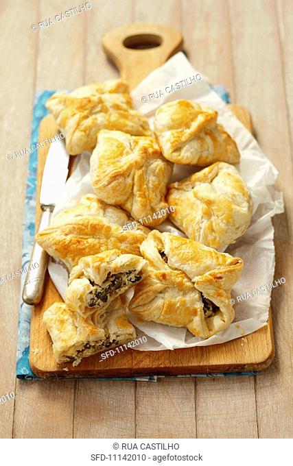 Puff pastry pocket with quark, olives and capers