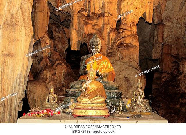 Buddha statue, lava tube, stalactite cave near Kanchanaburi, Thailand