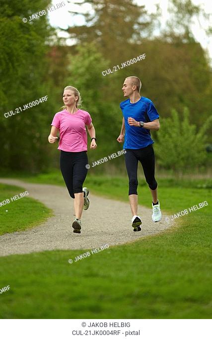Man and woman running in nature