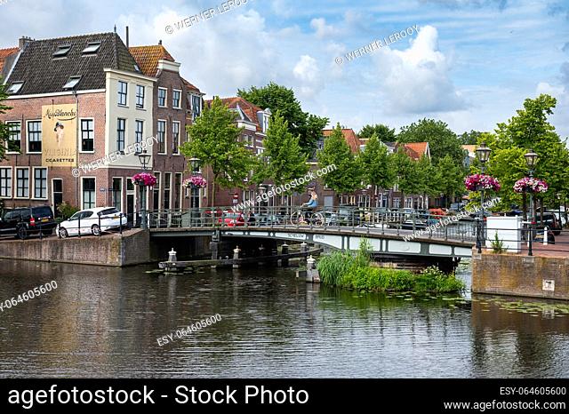 Leiden, Holland, The Netherlands, June 10, 2023 - Historical houses and vessels at the banks of the old river Rhine