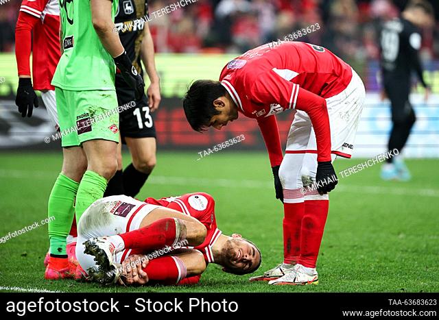 RUSSIA, MOSCOW - OCTOBER 22, 2023: Spartak Moscow's Srdan Babic (bottom) sustains an injury in a 2023/2024 Russian Premier League Round 12 football match...