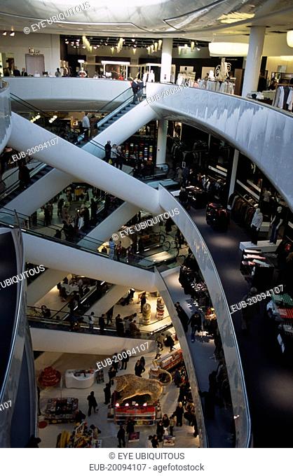 The Bullring Shopping Centre. Interior view of escalators and department stores on multiple levels