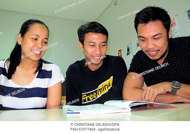 Lorenzo Ancheta (L), Francis Verdadero (C), and Sheila Monte learn German in a course at the Goethe Insitut in Manila, The Philippines, 16 January 2015