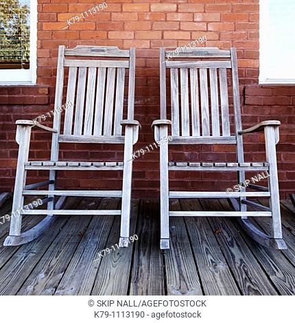 Two old rocking chairs on porch