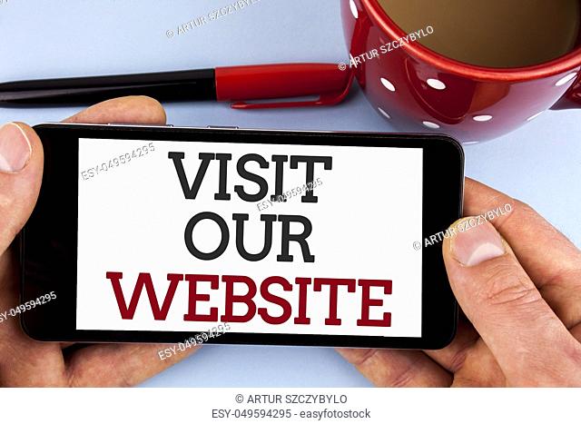 Word writing text Visit Our Website. Business concept for Invitation Watch web page Link to Homepage Blog Internet written Mobile Phone Screen holding by man...
