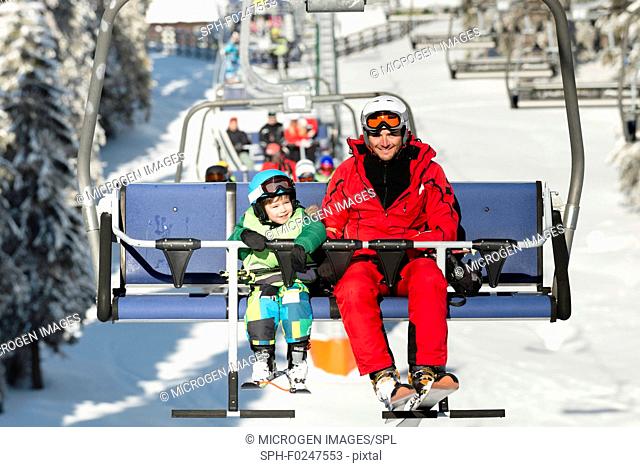 Father and son on ski lift
