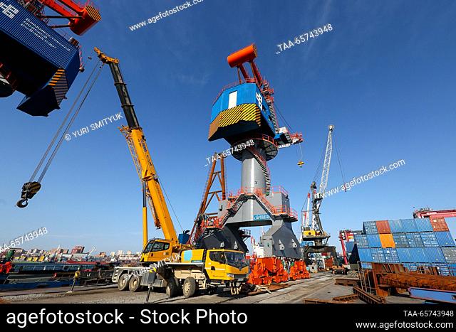RUSSIA, VLADIVOSTOK - DECEMBER 14, 2023: Cranes are seen at the Vladivostok Sea Fishing Port on Russia's Pacific coast. The port offers services for...