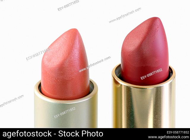 Closeup of open red lipsticks isolated on white