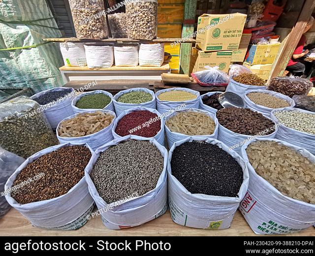 05 March 2023, Vietnam, Ho-Chi-Minh-Stadt: Legumes, nuts and dried fruit lie in bags for sale at a market in Ho Chi Minh City
