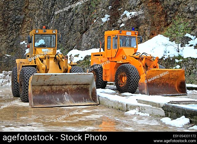 Two snow mover diggers for winter road maintenance