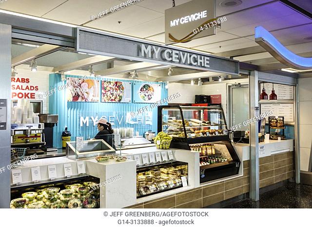 Florida, Miami, International Airport MIA, terminal concourse gate area, concession, My Ceviche, food counter, Hispanic, woman