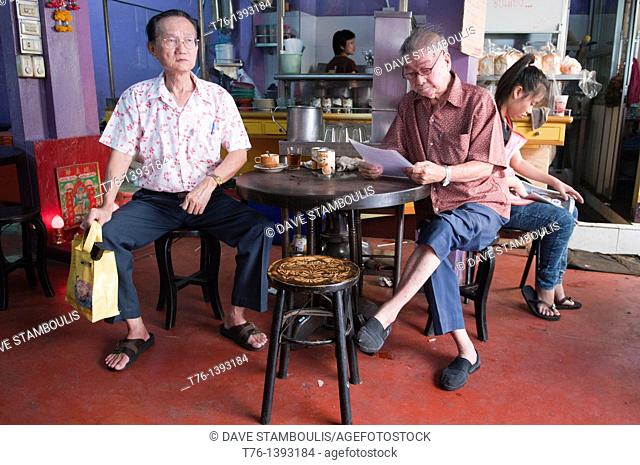 patrons in one of Bangkok's oldest coffe shops in Chinatown
