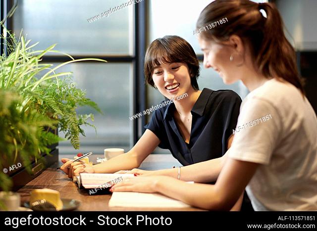 Young girlfriends at a cafe