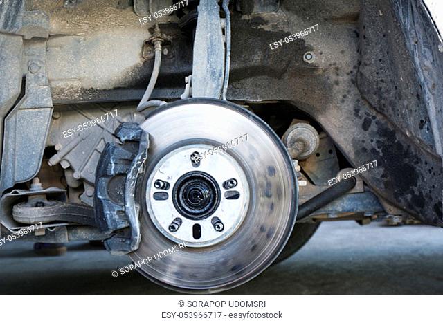 Closeup car disc brakes servicing for replacement tire