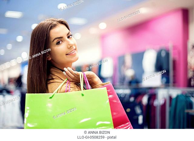 Attractive woman with shopping bags Debica, Poland