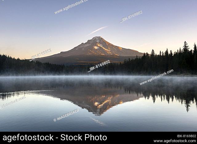 Reflection of Mt Hood volcano in Trillium Lake, at sunrise, Oregon, USA, North America