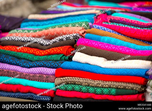 Colorful stack of handcrafted material at a market in San Cristobal, Mexico