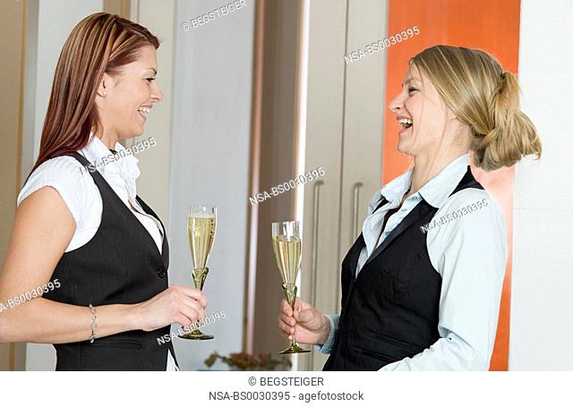 two lucky women drinking sparkling wine
