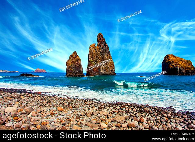 Three huge scenic rocks near the pebble beach. Concept of exotic and ecological tourism. Volcanic island of Madeira in the Atlantic Ocean