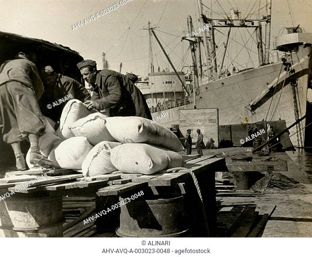 Foodstuffs & Munitions being unloaded in Naples Port from the Italian troops, shot 1944