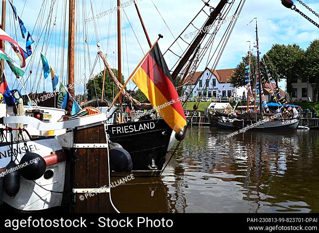 13 August 2023, Lower Saxony, Carolinensiel: Several traditional sailing ships are in the harbor on the occasion of the 32nd WattenSail