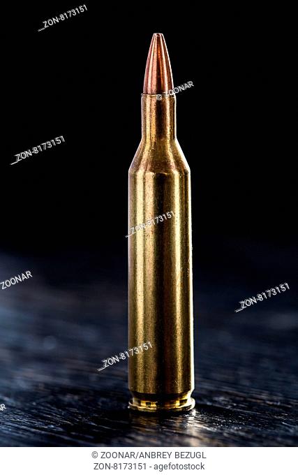 One bullet for a Kalashnikov 7.62mm on a black background