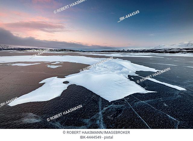 Frozen Lake Torneträsk, snowdrifts, dusk, Abisko National Park, Abisko, Norrbotten, Lapland, Sweden