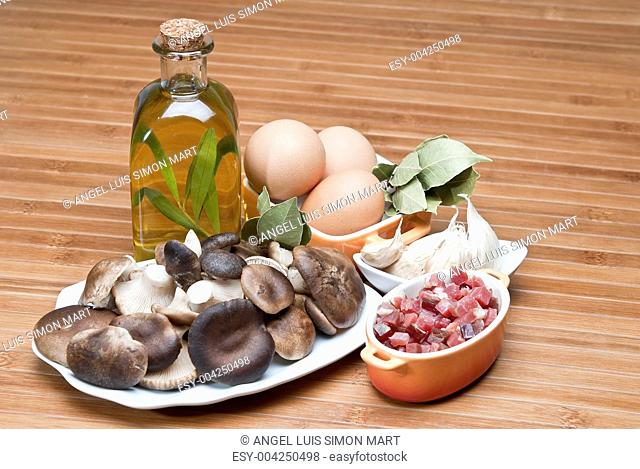 Mushrooms, eggs, ham and olive oil to cook