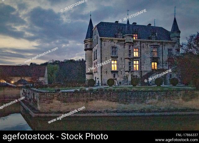 The illuminated moated castle Schaloen in Valkenburg aan de Geul at blue hour, Holland, Netherlands, Europe